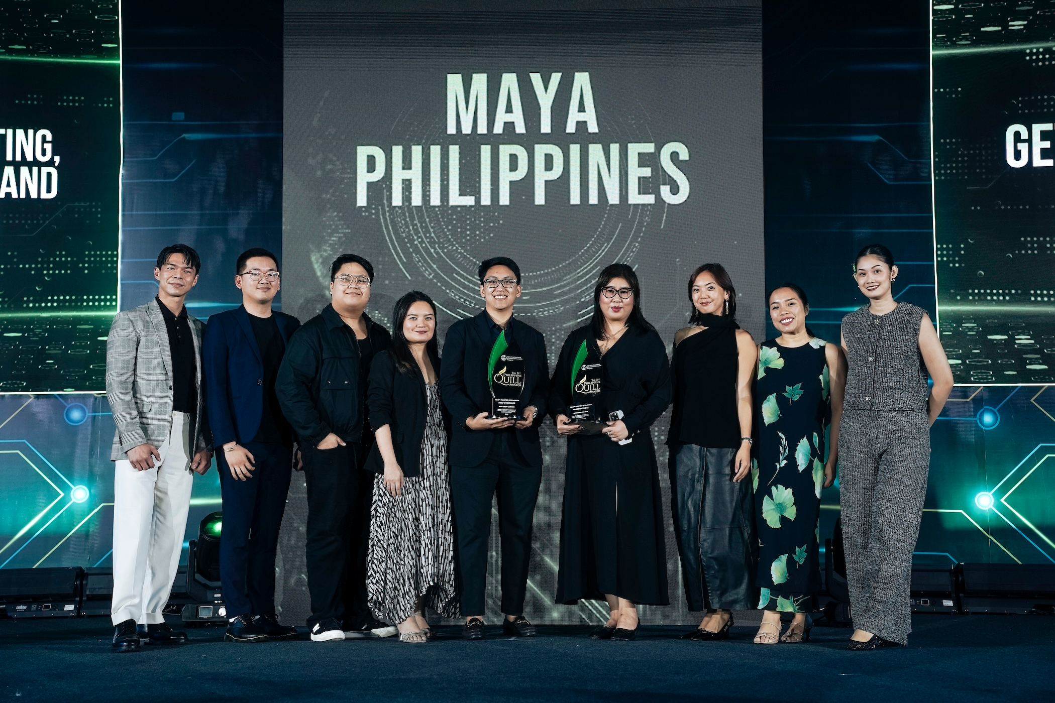 Maya executives pose for a souvenir photo after winning 7 Quill Awards at IABC event