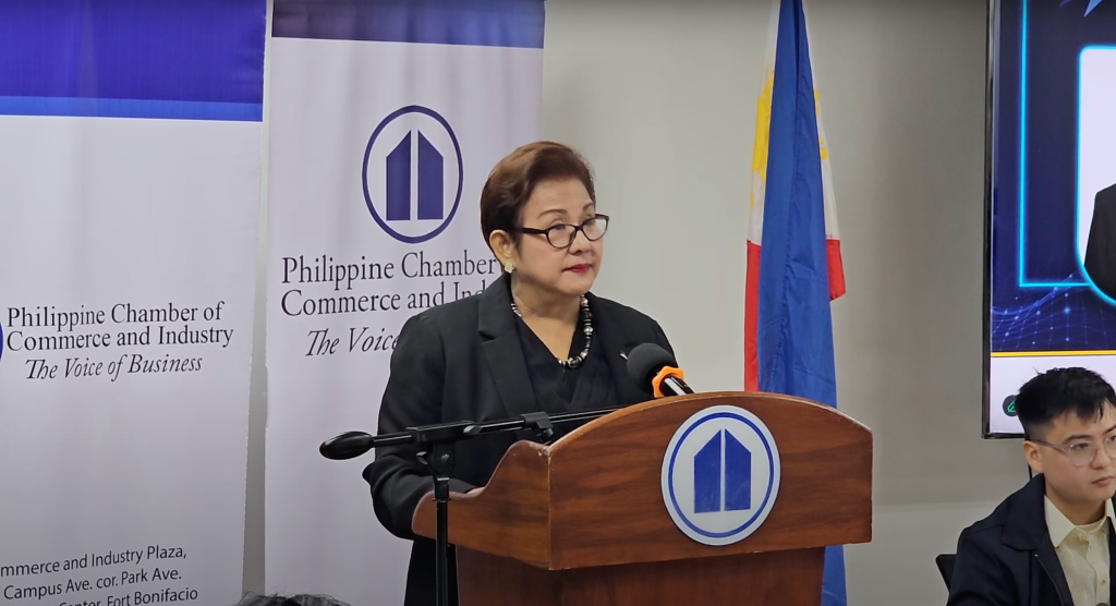 Enunina V. Mangio, President of the Philippine Chamber of Commerce and Industry (PCCI), speaking at the podium during the launch of the 51st Philippine Business Conference & Expo.