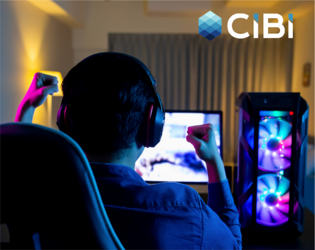 A man with headset pumps his fist in front of a monitor after reading a CIBI report about hiring fraud risks in the Philippine job market