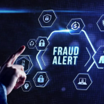 A man touches a screen with the words fraud alert as the country celebrates Cybersecurity Awareness Month