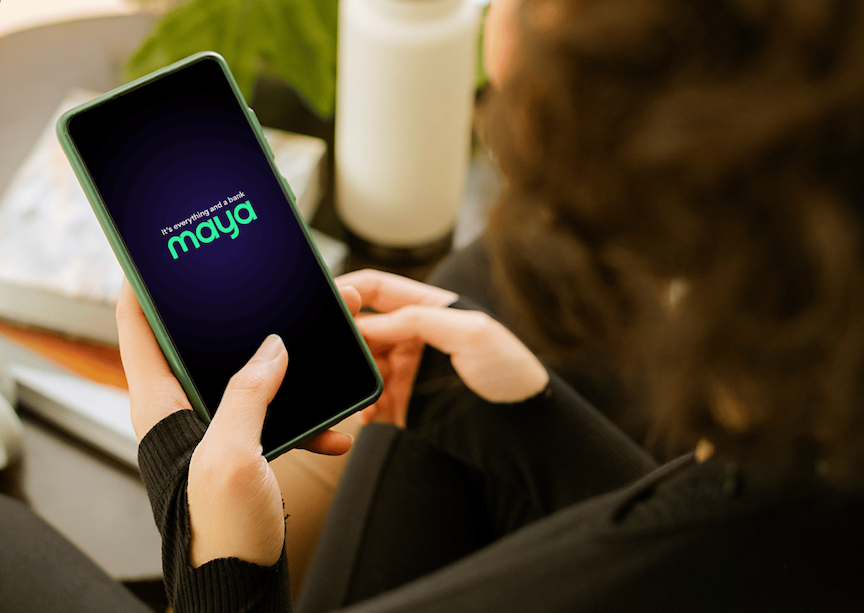 A woman using Maya on her mobile phone as the fintech firm gets crowned as world’s best digital bank after dominating local awards in PH