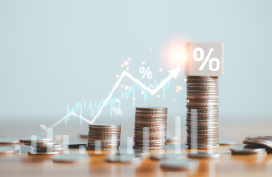 Image of stacked coins with line graph to illustrate digital bank interest rates