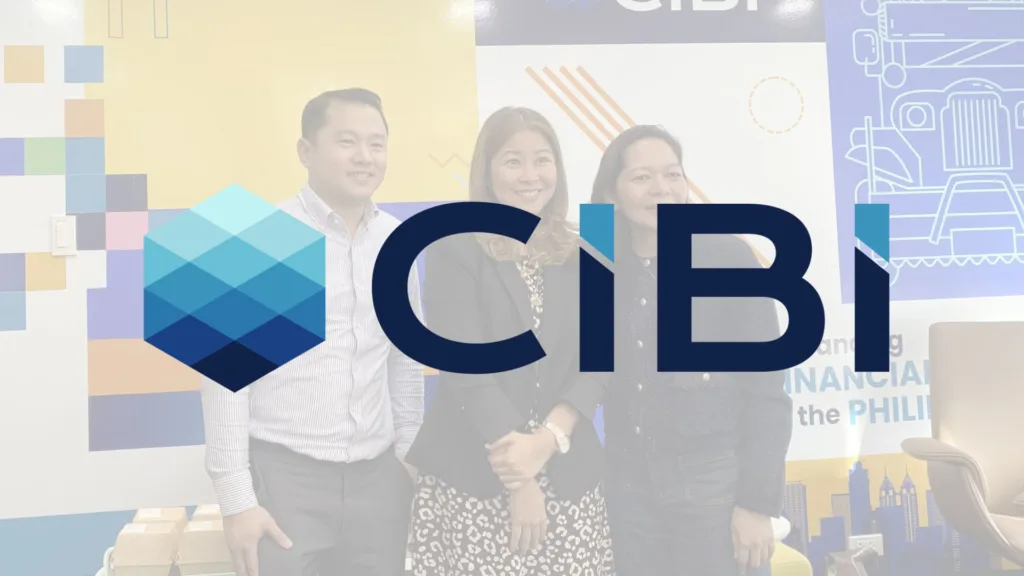Photo opportunity of Harley Chan, CIBI Analytics Officer; Pia Arellano, CIBI CEO and President; and Jasmine Gonzales, CIBI Head of Products with the big logo of CIBI in the center front