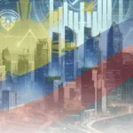 Image of an area with tall buildings covered by a Philippine flag watermark to show why BSP is cutting key rates as inflation eases while external pressures persist