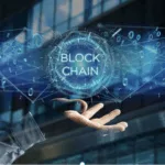 A hand opens up to the word "Blockchain"