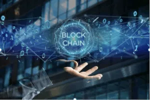 A hand opens up to the word "Blockchain"