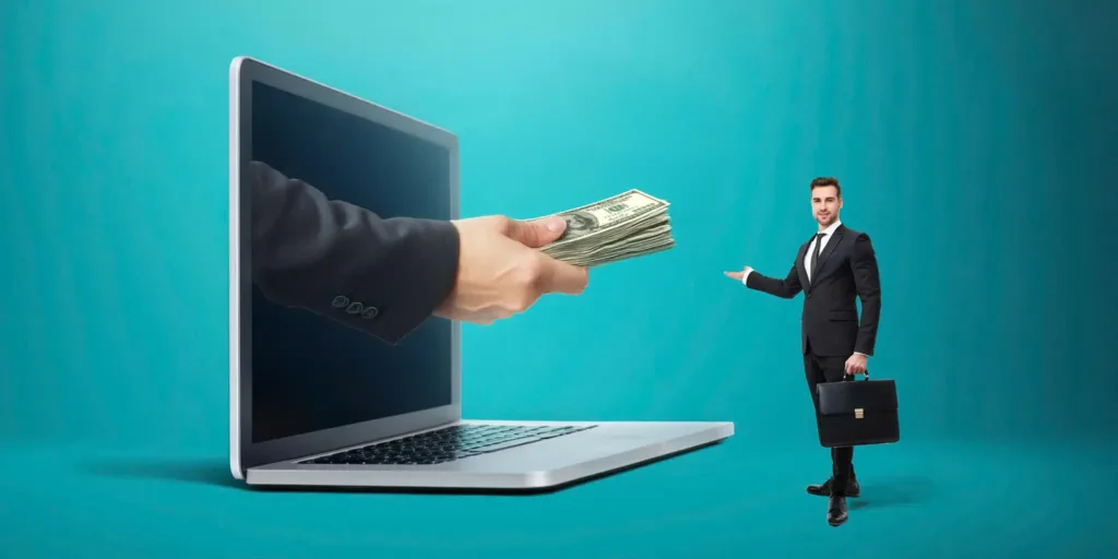 Digital wage access concept – a businessman receiving cash from a laptop, representing AgadPay’s earned wage access fintech solution in the Philippines.