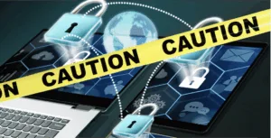 A laptop with locks around it is used to highlight need for caution as the SEC sounds alarm on rise of unauthorized online investment schemes
