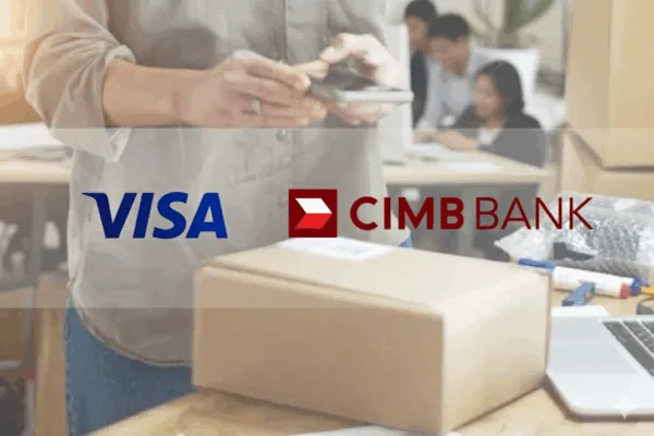 Logos of CIMB Bank and Visa on top of a photo of a man holding a mobile phone over a gift box