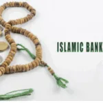 A rosary, some coins and the words "Islamic Banking"