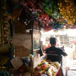 A man working in a sari-sari store is used to show how e-wallet use in these stores has since soared to 75%, driving grassroots digital transformation