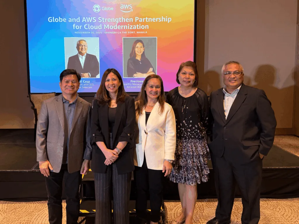 Five business professionals pose together on stage at the “Globe and AWS Strengthen Partnership for Cloud Modernization” event on November 6, 2025, in Manila, celebrating the collaboration between Globe Telecom and Amazon Web Services