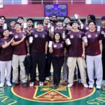 Executives of PalawanPay and members of the UP Fighting Maroons strike a pose after the fintech firm renewed its commitment to the UP Fighting Maroons, highlighting partnership and shared purpose