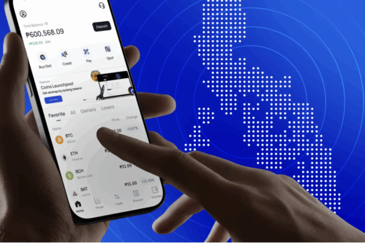 With PH map in the background, a mobile phone is used here to transfer money, as Coins.ph, FinFan team up to boost PH–Vietnam remittances with faster, USD-based transfers