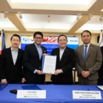 Executives of SSS and Manulife pose for a souvenir photo during the signing of an MOU meant to expand credit life insurance coverage for pension loan borrowers in PH