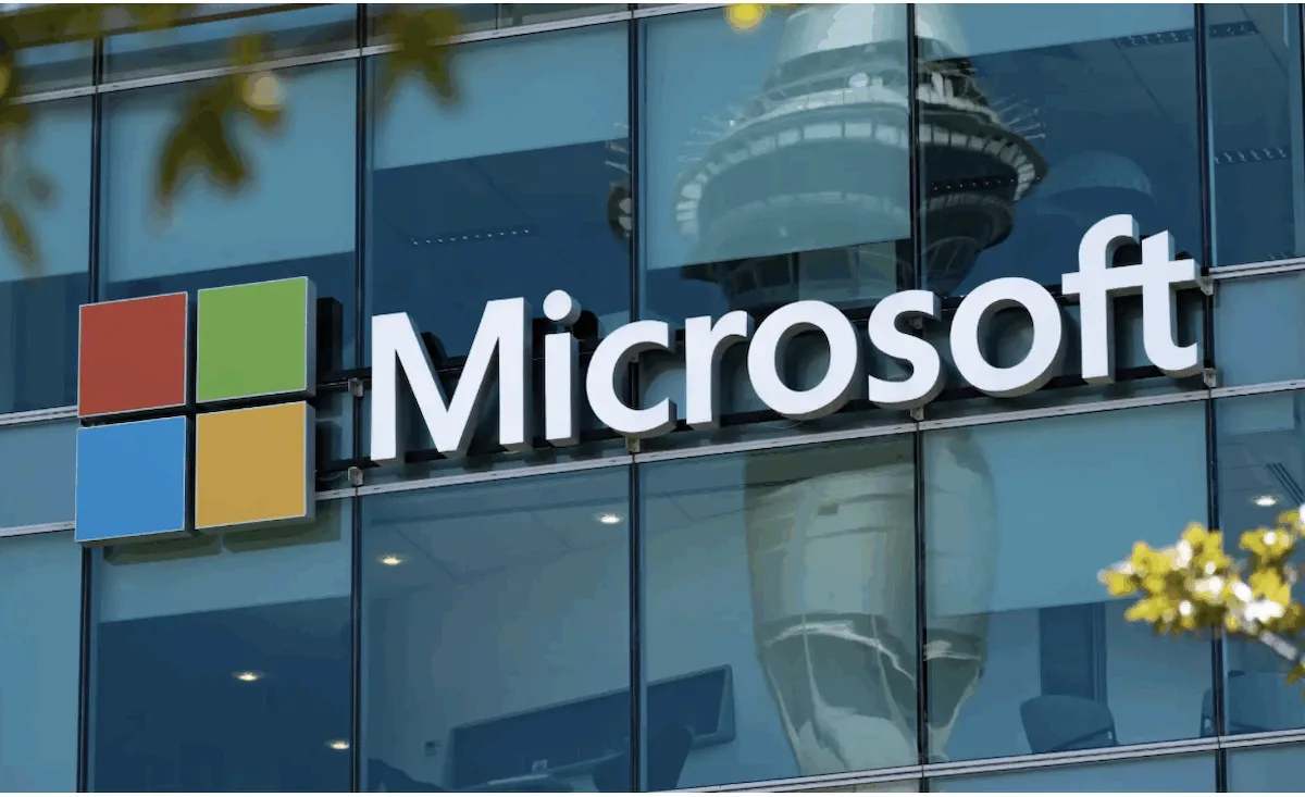 Logo of Microsoft posted on a window to show its campaign against AI-driven scams