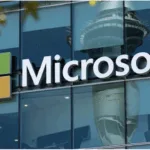 Logo of Microsoft posted on a window to show its campaign against AI-driven scams