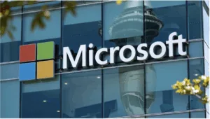 Logo of Microsoft posted on a window to show its campaign against AI-driven scams