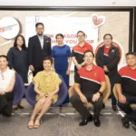 BPI and Robinsons execs strike a pose after completing a deal that would allow BPI customers to withdraw cash for free at Robinsons supermarket