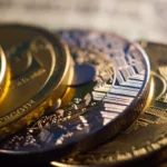 A pile of cryptocurrency coins as Coins.ph pushes stablecoins among OFWs