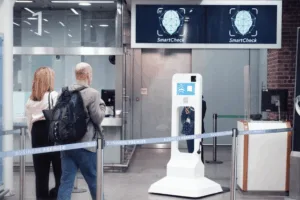 A man and woman about to enter a train station with iProov protection as the company becomes the first biometrics firm to meet new U.S. deepfake-resilience standards