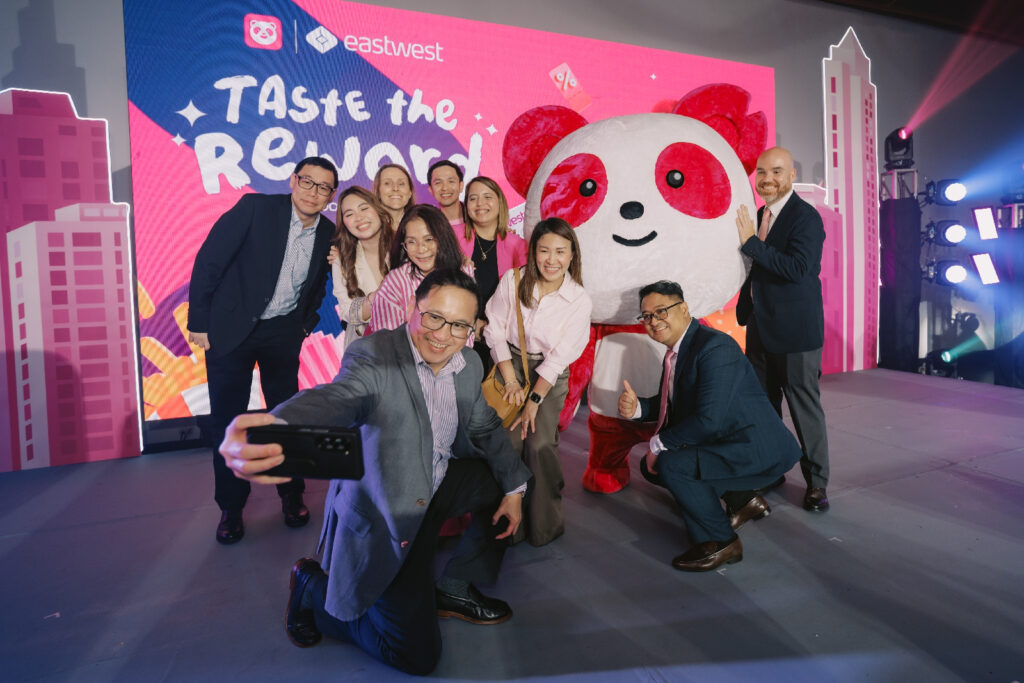 Executives taking a "selfie" with Pau-Pau during the launch.