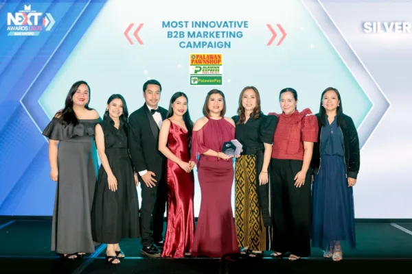 Executives of Palawan Group strike a pose after winning silver at NEXT Awards Asia-Pacific 2025
