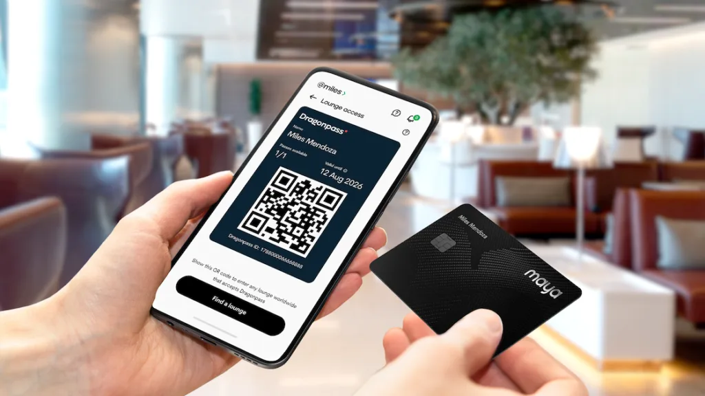 Maya, M Pioneer roll out in-app travel insurance to close protection gap for Filipino travelers 4 Image of a mobile phone and the Maya Black card as the fintech company and Dragonpass make premium travel as simple as a tap