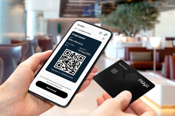Image of a mobile phone and the Maya Black card as the fintech company and Dragonpass make premium travel as simple as a tap