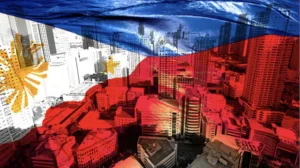 Flag of PH and tall buildings in financial district as BSP says economy on the right track