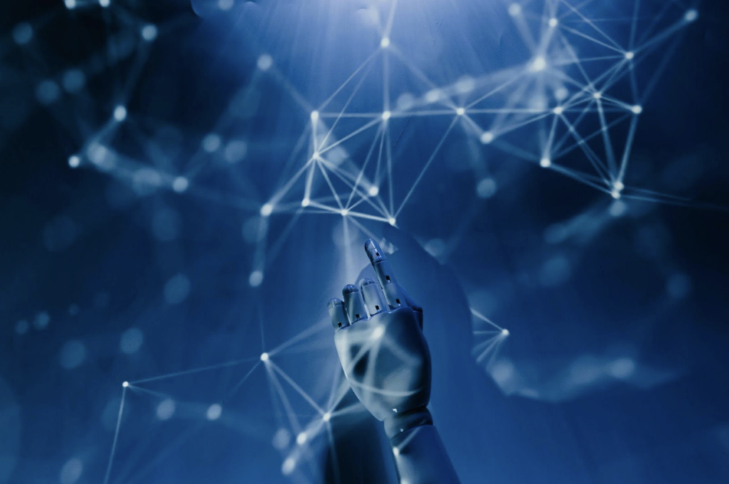 As digital fraud rises, AI and Machine Learning offer stronger protection for financial services 2 2 robot hands in blue background to show how as digital fraud rises, AI and Machine Learning offer stronger protection for financial services