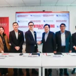 Executives of Discovery Capital Finance Corporation and PHILGUARANTEE during the MOA-signing aimed at expanding SME financing nationwide