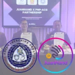 Four representatives from JuanHand and the Philippine National Police Anti-Cybercrime Group (PNP-ACG) sit at a table holding signed partnership documents during a formal signing ceremony in Manila. A screen behind them reads “JuanHand x PNP-ACG Partnership,” with the JuanHand and PNP-ACG logos displayed in the foreground, highlighting their collaboration to combat cybercrime in digital lending