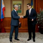 BSP Gov. Remolona shaking hands with Finance Secretary Frederick Go after the latter has joined the BSP Monetary Board