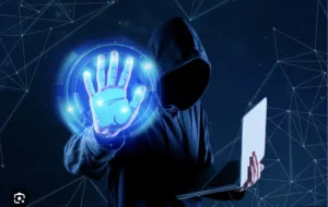 Image of a hacker in blue background to show why cybersecurity risks are rising as Filipinos go cashless