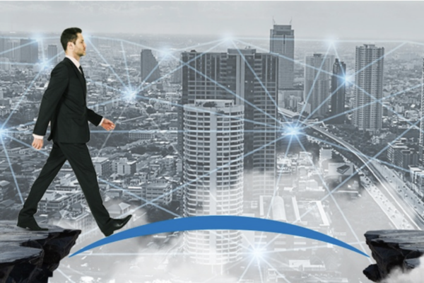A man crossing a bridge as fintech puts MSMEs at the center, but access gaps still persist