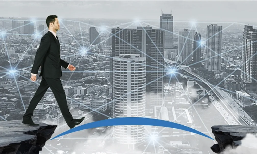 A man crossing a bridge as fintech puts MSMEs at the center, but access gaps still persist