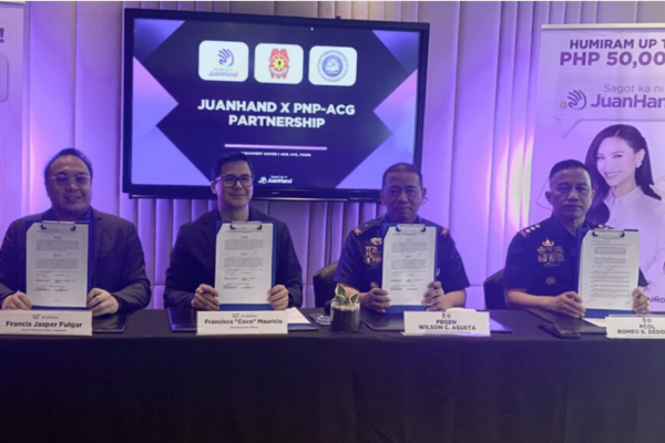 Executives of PNP-ACG and JuanHand during the signing of a partnership agreement to help Filipinos fight cybercrime and online lending scams