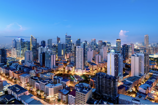Image of tall buildings in the financial district as Metrobank sees moderate Philippine economic recovery in 2026 amid easing inflation, rate cuts