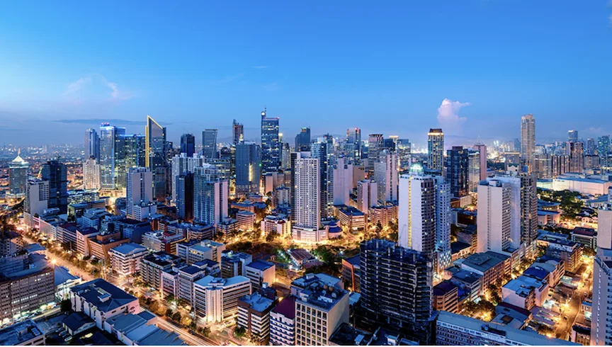 Image of tall buildings in the financial district as Metrobank sees moderate Philippine economic recovery in 2026 amid easing inflation, rate cuts