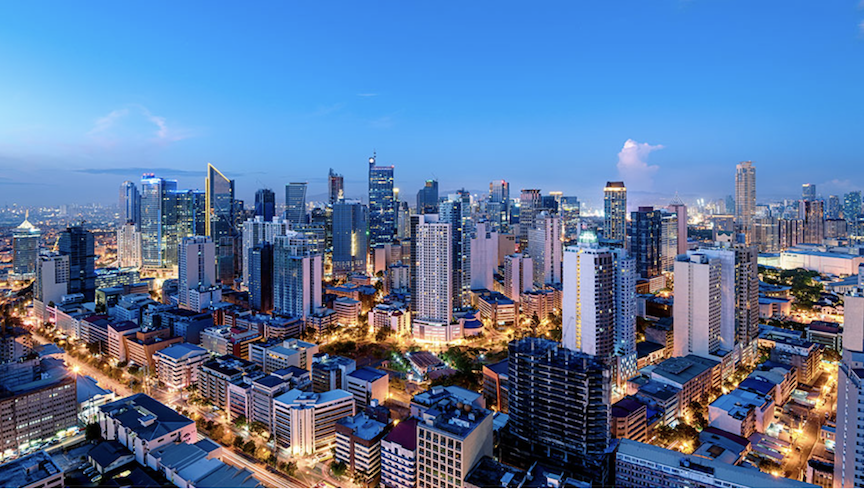Image of tall buildings in the financial district as Metrobank sees moderate Philippine economic recovery in 2026 amid easing inflation, rate cuts