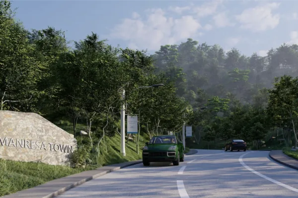 A car entering Manresa Town as CLI, Xavier University to deliver Php120-million Manresa Access Road
