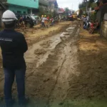 A man wearing a hard hat overseeing road reconstruction as CLI demonstrates its commitment to long-term community recovery in Cebu