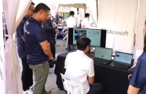 Pres. Ferdinand Marcos Jr. (seated) trying out the DepEd and Microsoft program called Microsoft Reading Progress, a Microsoft Learning Accelerator, and scored 98 percent.