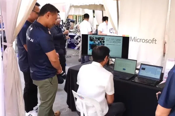 Pres. Ferdinand Marcos Jr. (seated) trying out the DepEd and Microsoft program called Microsoft Reading Progress, a Microsoft Learning Accelerator, and scored 98 percent.