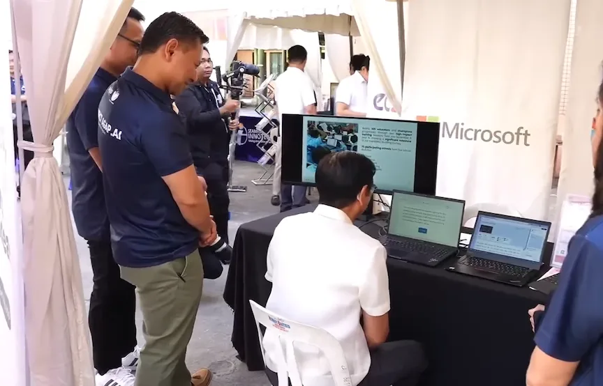 Pres. Ferdinand Marcos Jr. (seated) trying out the DepEd and Microsoft program called Microsoft Reading Progress, a Microsoft Learning Accelerator, and scored 98 percent.