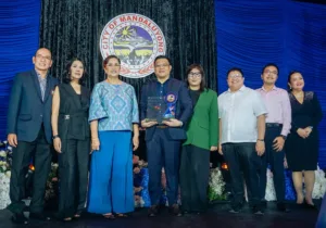 Executives of digital finance firm Maya pose with their trophy as the digital finance firm gets cited as one of Mandaluyong City’s top taxpayers