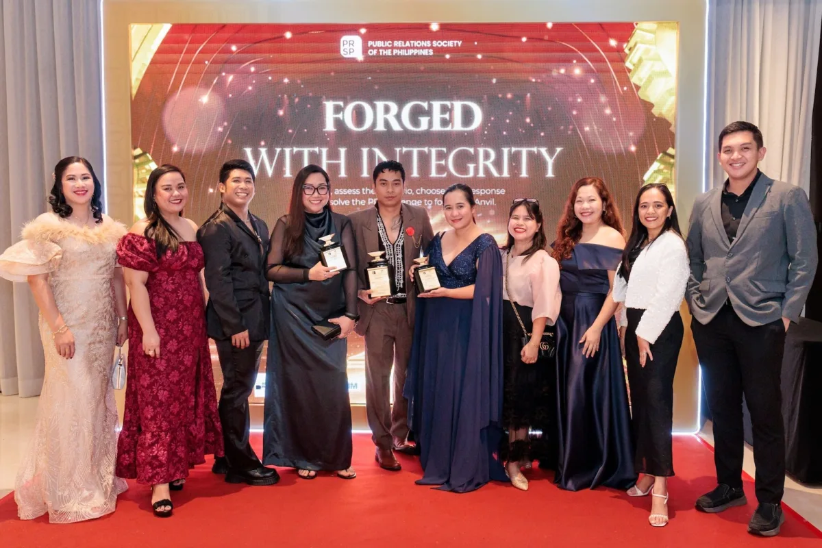 Executives and officers of the Palawan Group of Companies celebrate the group’s triple wins at the 61st ANVIL Awards