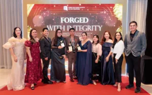 Executives and officers of the Palawan Group of Companies celebrate the group’s triple wins at the 61st ANVIL Awards