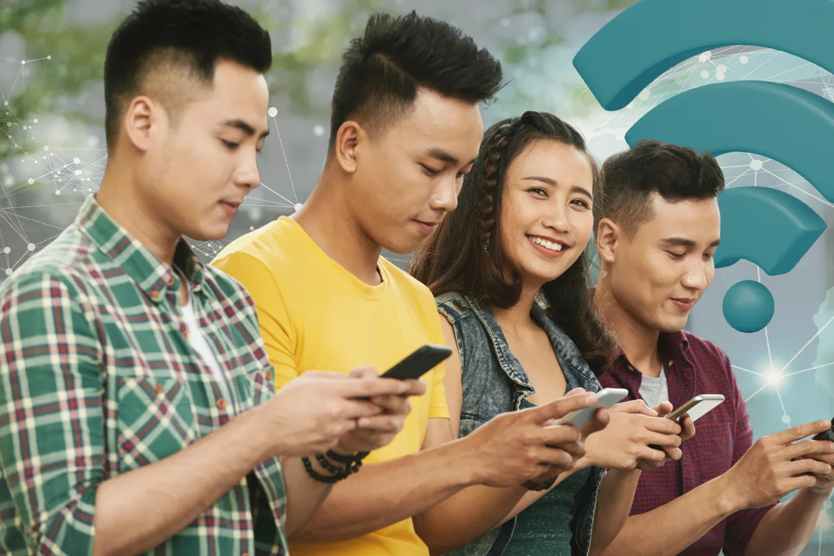 Young Filipinos using smartphones with a digital network overlay and Wi-Fi symbol, representing expanding internet access and connectivity in the Philippines